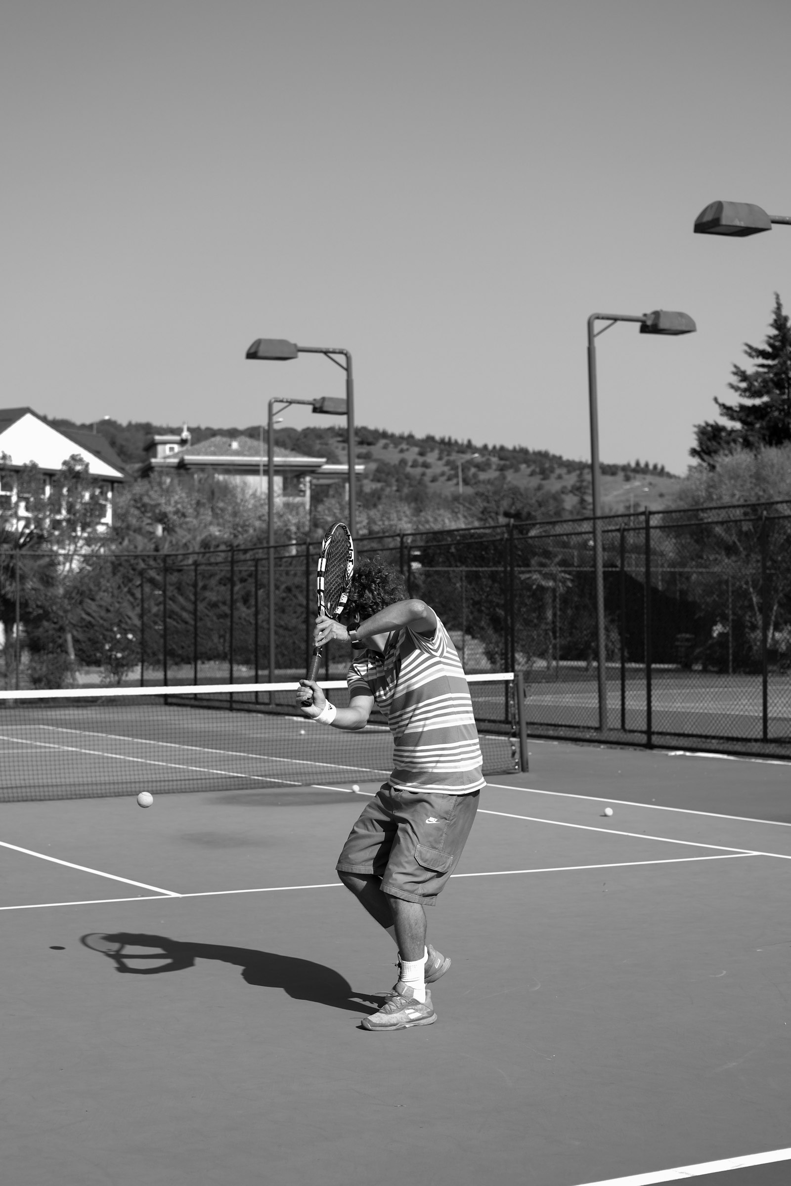 Player working through a full stroke on court